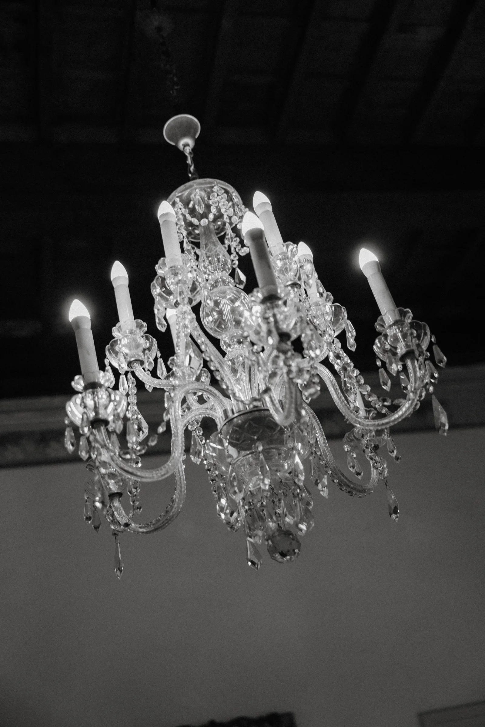 Black and white close view of the villa's crystal chandelier