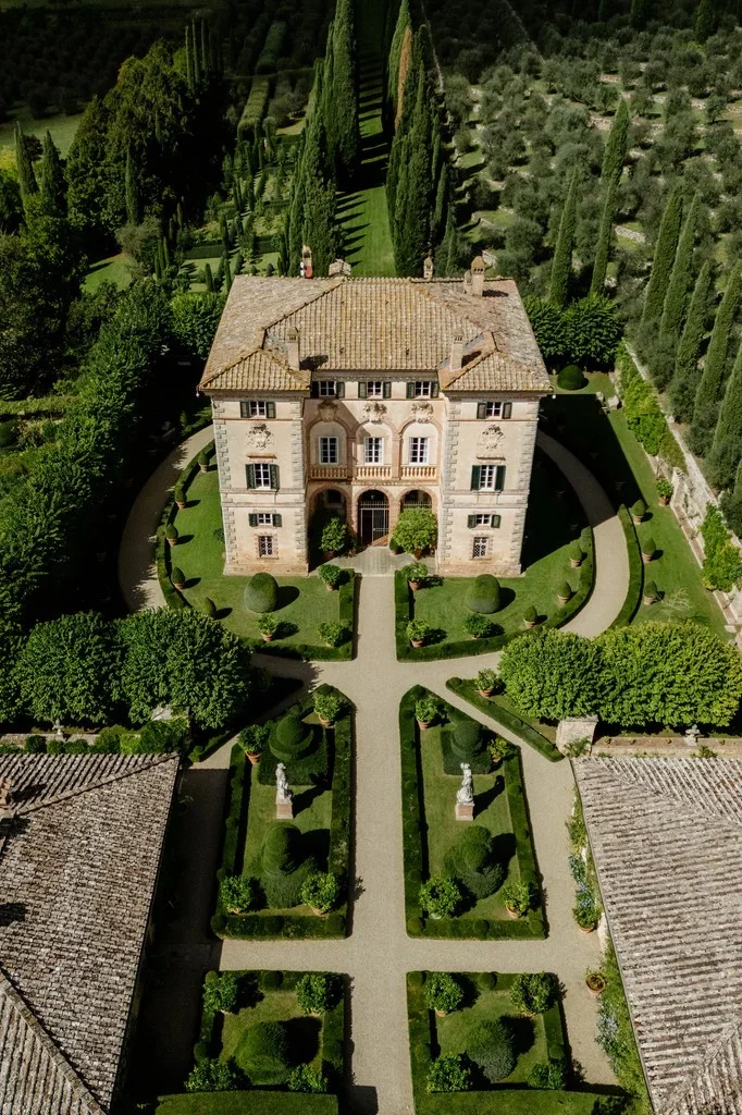 Aerial view of a country villa with formal box hedge gardens